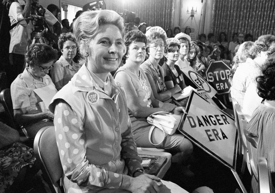 Women opposed to the Equal Rights Amendment sit Aug. 10, 1976, with Phyllis Schlafly, left, national chairman of Stop ERA, at hearing of Republican platform subcommittee on human rights and responsibilities in a free society in Kansas City, Mo. Schlafly, who helped defeat the Equal Rights Amendment in the 1970s and founded the Eagle Forum political group, has died at age 92. The Eagle Forum announced her death in a statement Monday.