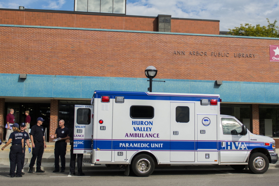 In this September 9, 2014 file photo, Ann Arbor police, firemen, and medical personnel respond to an overdose at the Ann Arbor District Library in Ann Arbor, Mich.