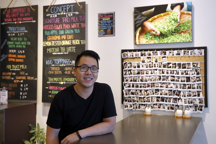 Mathew Wong poses for portrait at Tea and Milk, a bubble tea shop he co-owns in the Astoria neighborhood in the Queens borough of New York. Wong and his business partners developed a strategy they hope makes their shop stand out and allow it to thrive even if the popularity of bubble tea wanes.