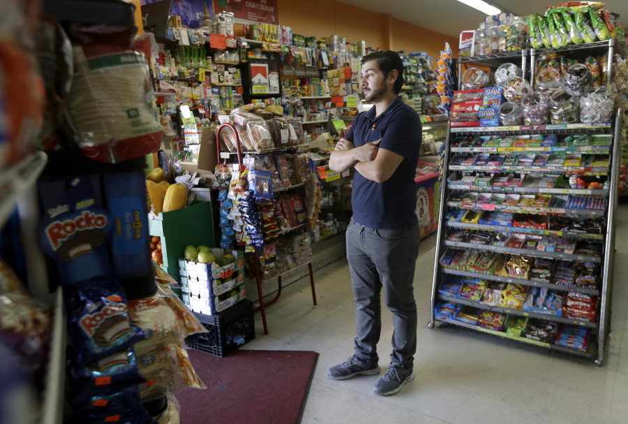 Alex Del Rio stands in the doorway while posing for photos at his family&#039;s market El Ahorro in San Francisco, Wednesday. In November 2016, voters in San Francisco and Oakland will consider a penny per ounce tax on sugar laden drinks such as bottled cola, sports drinks and iced teas in November.