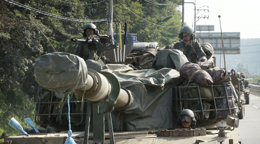 South Korean army soldiers ride a K-9 self-propelled artillery vehicle during an exercise in Paju, South Korea, near the border with North Korea on Monday. North Korea on Monday fired three suspected medium-range missiles that traveled about 1,000 kilometers (620 miles) and landed near Japan in an apparent show of force timed to coincide with the G-20 economic summit in China, South Korean officials said.
