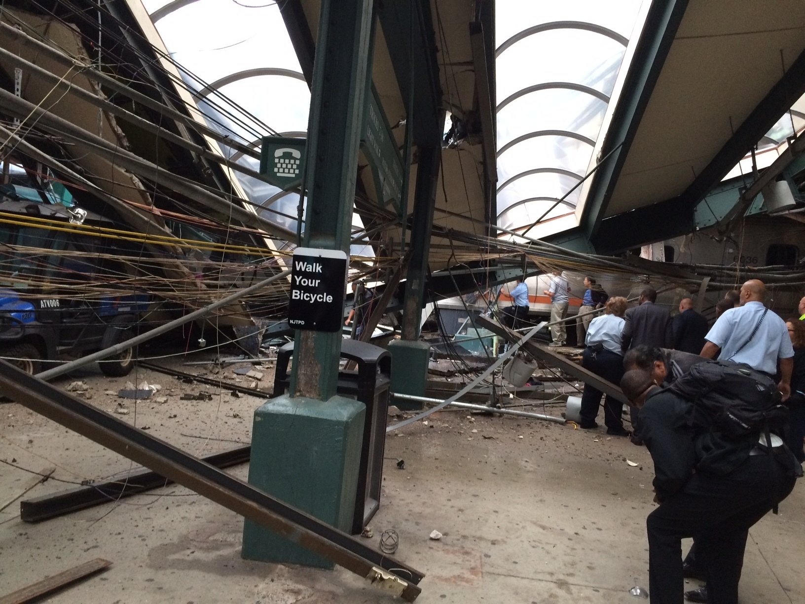 In a photo provided by William Sun, structural damage is seen at the train station in Hoboken, N.J., after a New Jersey Transit commuter train crashed into the station during the morning rush hour, Thursday, Sept. 29, 2016. The crash caused an unknown number of injuries and witnesses reported seeing one woman trapped under concrete and many people bleeding.