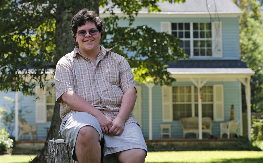 In this Monday, Aug. 22, 2016 photo, transgender high school student Gavin Grimm poses in Gloucester, Va. Grimm, who was born female but identifies as male, heads back to Gloucester High School for his senior year as the U.S. Supreme Court considers whether to intervene in his case that challenges the county school???s policy barring him from using the bathroom of his choice.