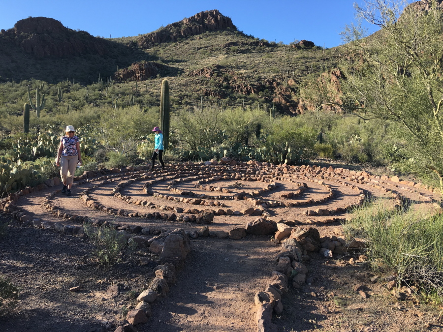 Two visitors walk a circular labyrinth Feb. 28 at Sanctuary Cove in Marana, Ariz. A sign at the entrance reads: &quot;Absorb the beauty that surrounds you. Take time to clear your mind.