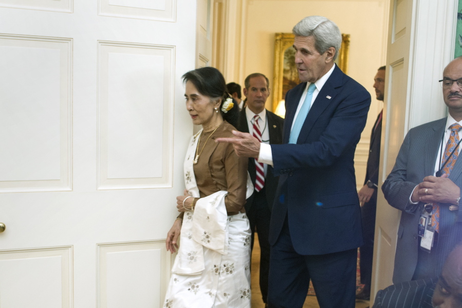 Secretary Kerry escorts Myanmar leader Aung San Suu Kyi into a room at Blair House in Washington, Wednesday, Sept. 14, 2016, prior to a luncheon.