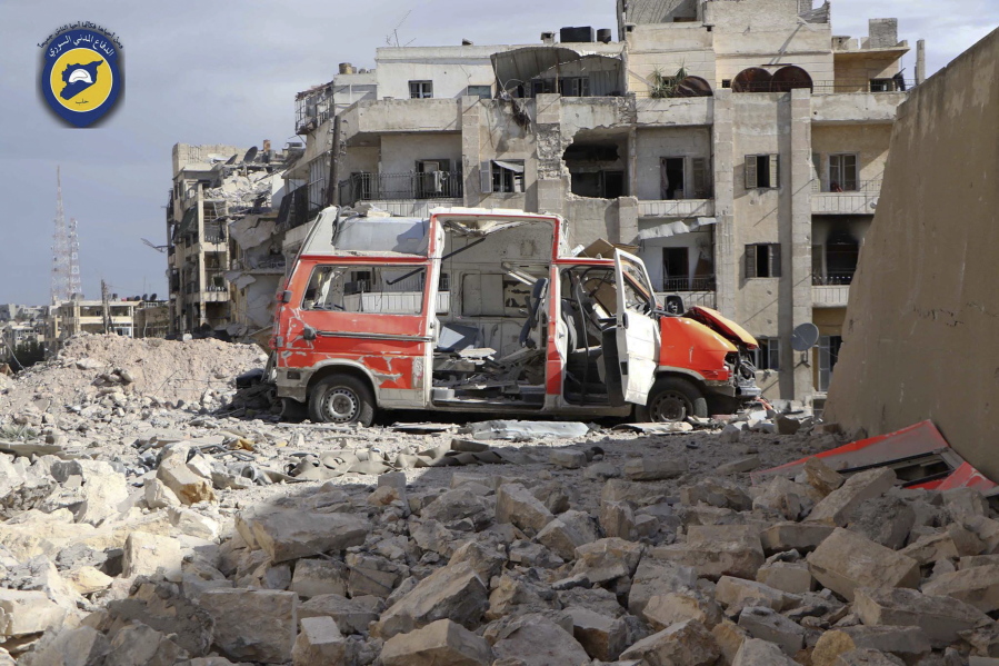 In this photo provided by the Syrian Civil Defense group known as the White Helmets, taken Sept. 23, 2016, a destroyed ambulance is seen outside the Syrian Civil Defense main center after airstrikes in Ansari neighborhood in the rebel-held part of eastern Aleppo, Syria. A year after Russia waded into the war in Syria, aiming to flex its national security muscles and prop up beleaguered Syrian President Bashar Assad, Moscow appears no closer to one of its military goals: getting the U.S. to coordinate combat operations in the civil war. And prospects of a diplomatic resolution seem dim.