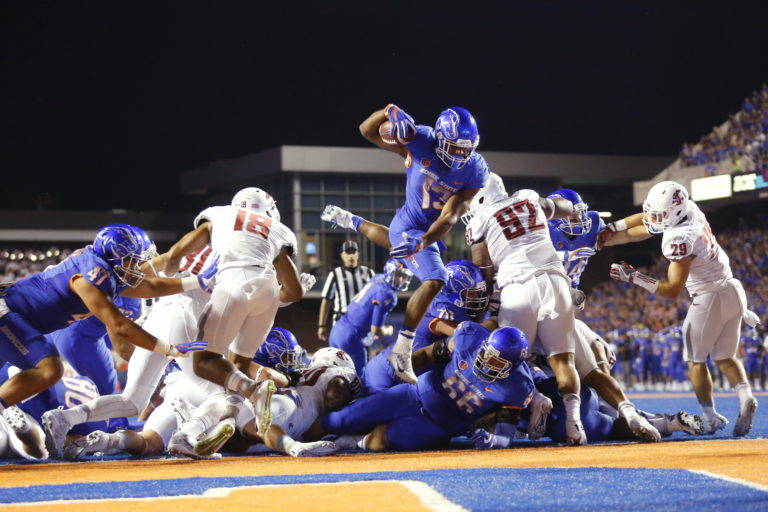 Boise State running back Jeremy McNichols (13) leaps into the end zone for a touchdown during the first half of an NCAA college football game against Washington State in Boise, Idaho, Saturday, Sept. 10, 2016.