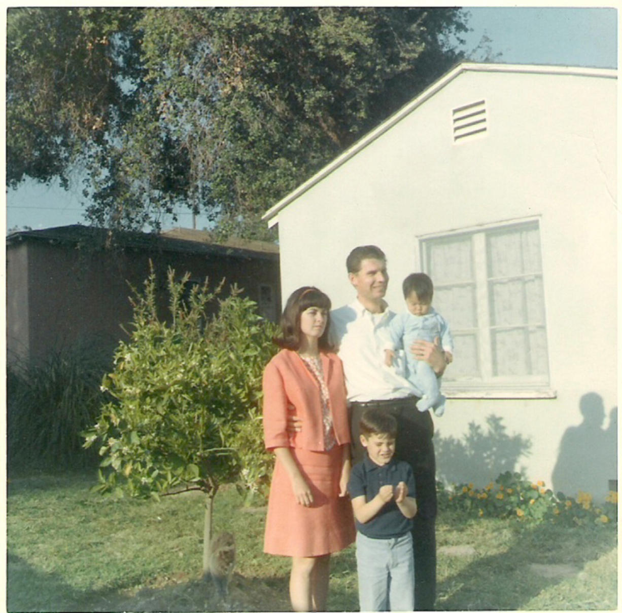 Joy Alessi is shown as a baby with her adoptive family at her childhood home in Los Angeles around 1967.