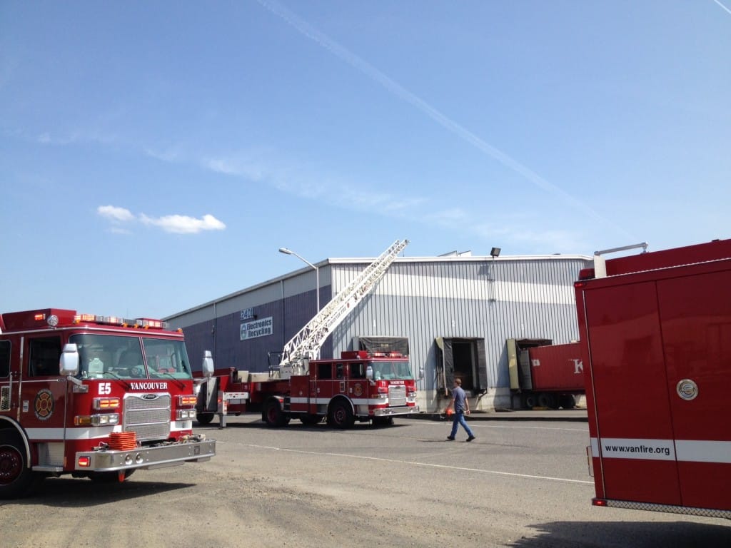 Crews from the Vancouver Fire Department work at the scene of a two-alarm commercial fire in September 2015 at IMS Electronics Recycling in the Fruit Valley neighborhood.