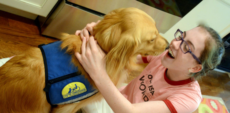 Twelve-year-old Hannah Albus&#039;s shirt, which says, &quot;Love is a four-legged word,&quot; sums up her feelings on her assistance dog, Nasca.