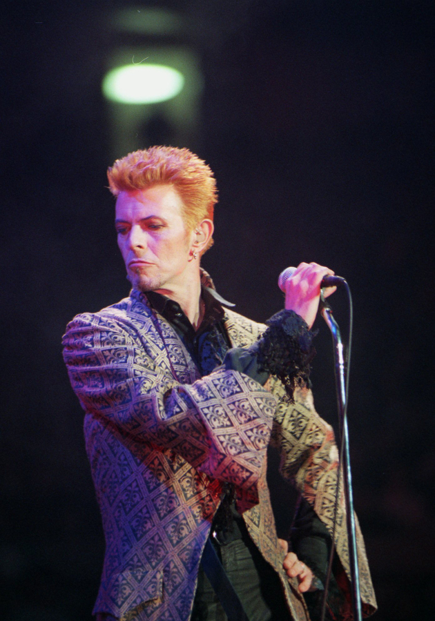 David Bowie performs during a concert celebrating his 50th birthday, at Madison Square Garden in New York on Jan. 9, 1997. Bowie, the innovative and iconic singer whose illustrious career lasted five decades, died Monday, Jan. 11, 2016, after battling cancer for 18 months. He was 69.