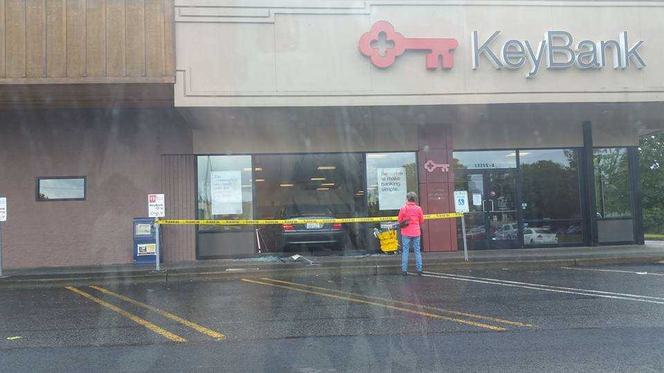 The aftermath following a non-injury crash where someone drove over a curb and through a KeyBank branch's front window Wednesday afternoon in east Vancouver.