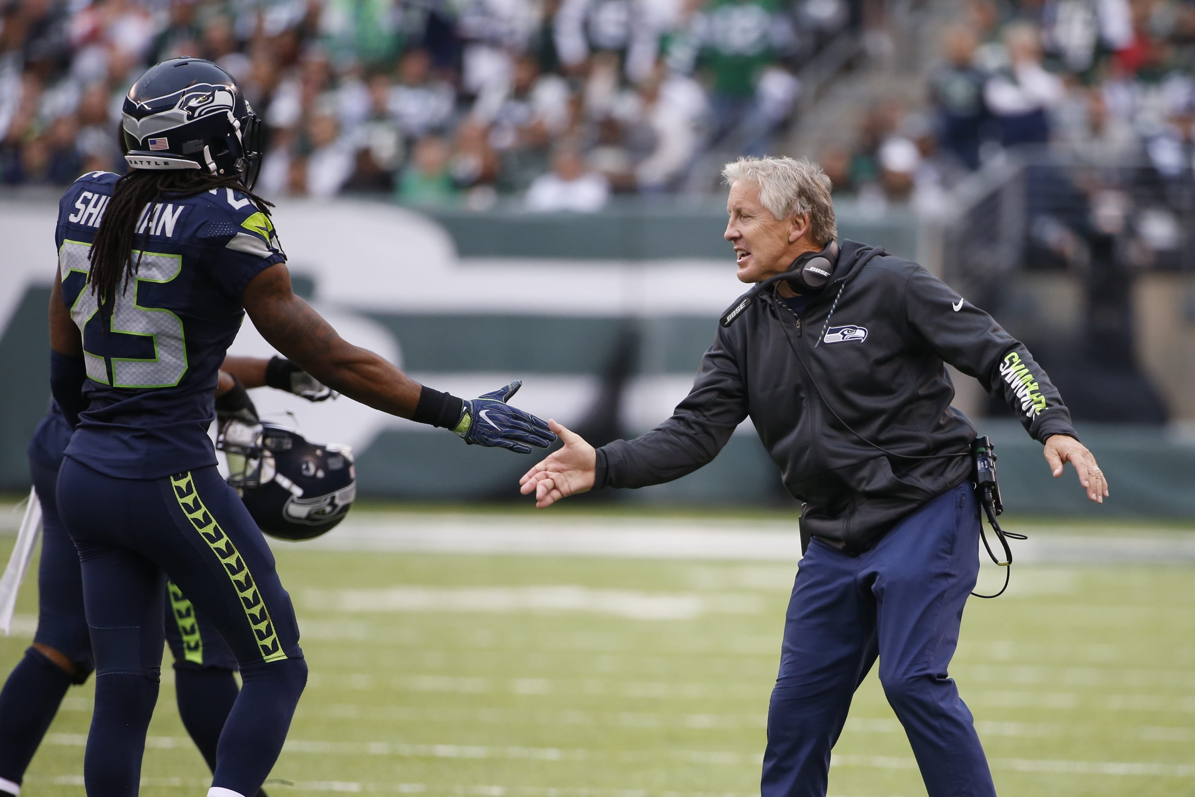 Seattle Seahawks head coach Pete Carroll celebrates with cornerback Richard Sherman (25) during the first half of an NFL football game against the New York Jets Sunday, Oct. 2, 2016, in East Rutherford, N.J.