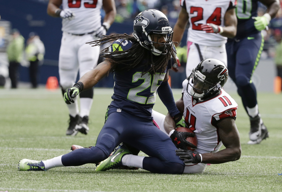 Seattle Seahawks cornerback Richard Sherman (25) gets up after tackling Atlanta Falcons wide receiver Julio Jones (11) in the Seahawks&#039; win over the Falcons.