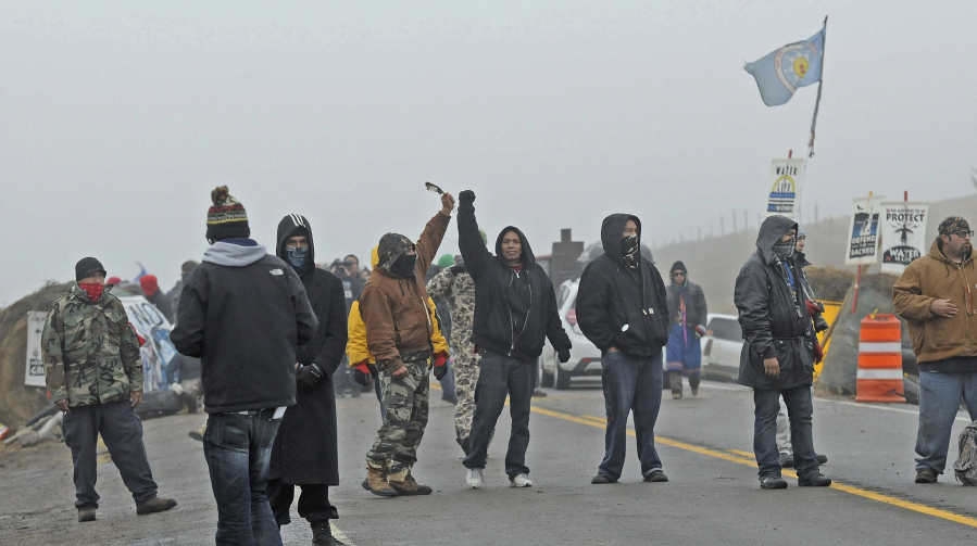 Protesters block Highway 1806 on Wednesday morning at the site of the encampment set up on private land protesting the Dakota Access pipeline.