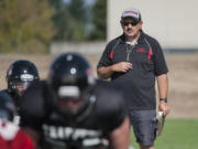 Fort Vancouver High School head coach Cal Szueber keeps an eye on the action during practice Wednesday afternoon, August 26, 2015 at his team's practice field.