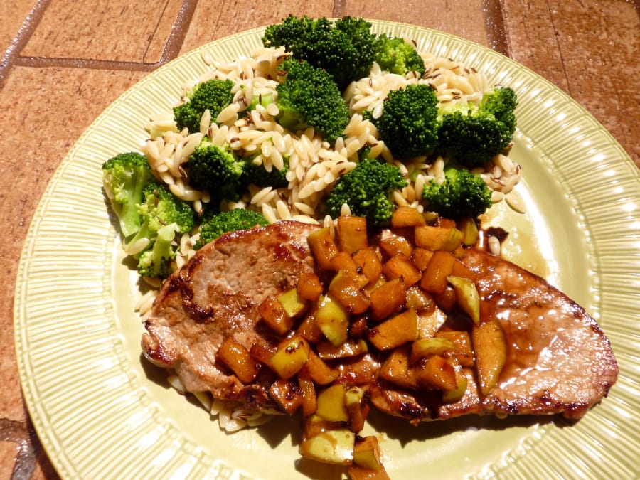 Veal with maple-kissed apples and broccoli caraway orzo.