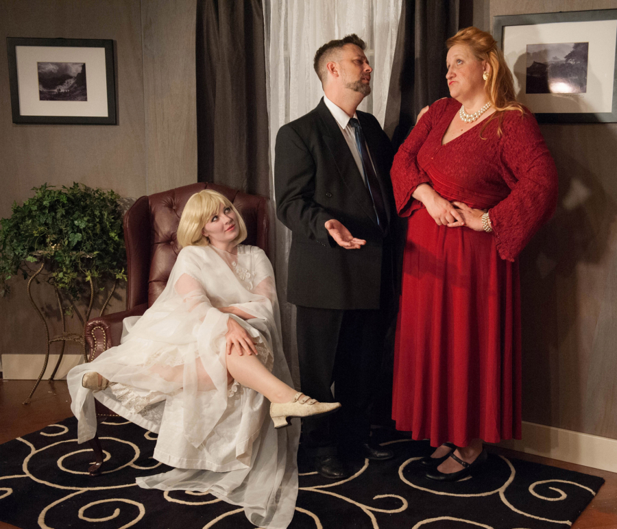 In &quot;Blithe Spirit,&quot; Charles and Ruth (Vancouver actors Jason England and Alicia Turvin) struggle to work things out -- while the ghostly Elvira (Rebecca Overall, seated) does her best to prevent it.