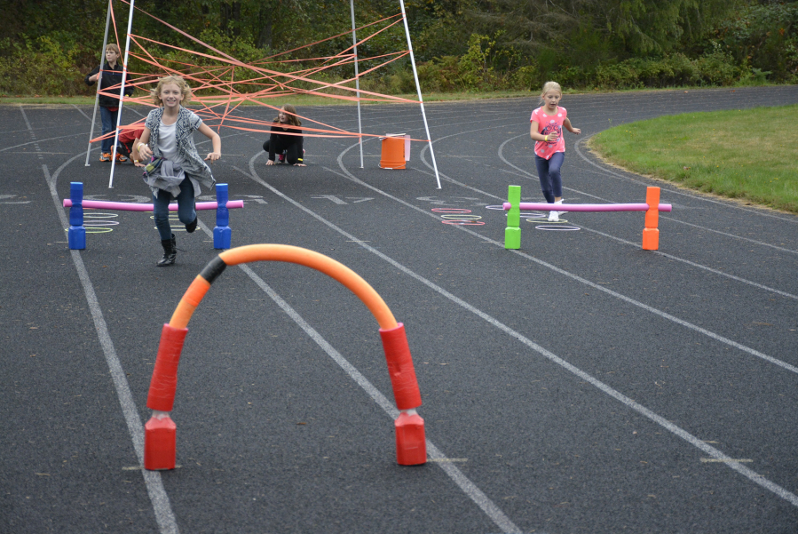 Washougal: Cape Horn-Skye Elementary School students Kiana Evans, left, and Jenevieve Neibuhr compete in the Kodak Ninja Warrior Challenge, which raised more than $3,000 for a new playground structure.