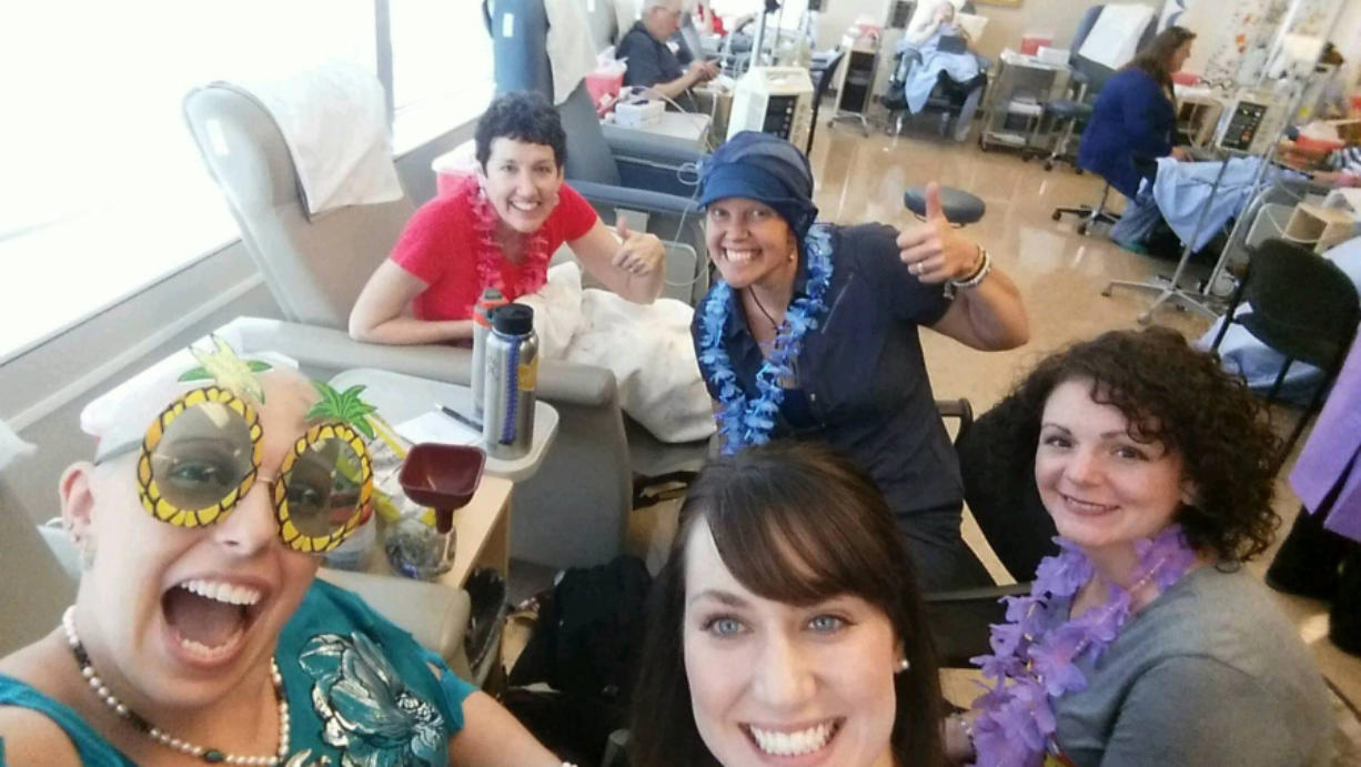 Before her weekly chemotherapy sessions, Adrienne San Nicolas bought decorations, games and toys at the Dollar Store for parties in the chemo suite. Her friends, other patients and nurses all donned leis for this party, which had a tropical theme.
