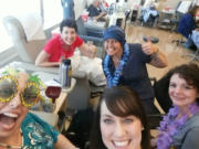 Before her weekly chemotherapy sessions, Adrienne San Nicolas bought decorations, games and toys at the Dollar Store for parties in the chemo suite. Her friends, other patients and nurses all donned leis for this party, which had a tropical theme.