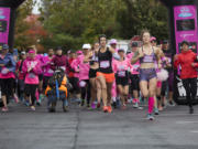 Runners set off at the starting line of the annual Girlfriends Run for a Cure in Vancouver on Sunday.