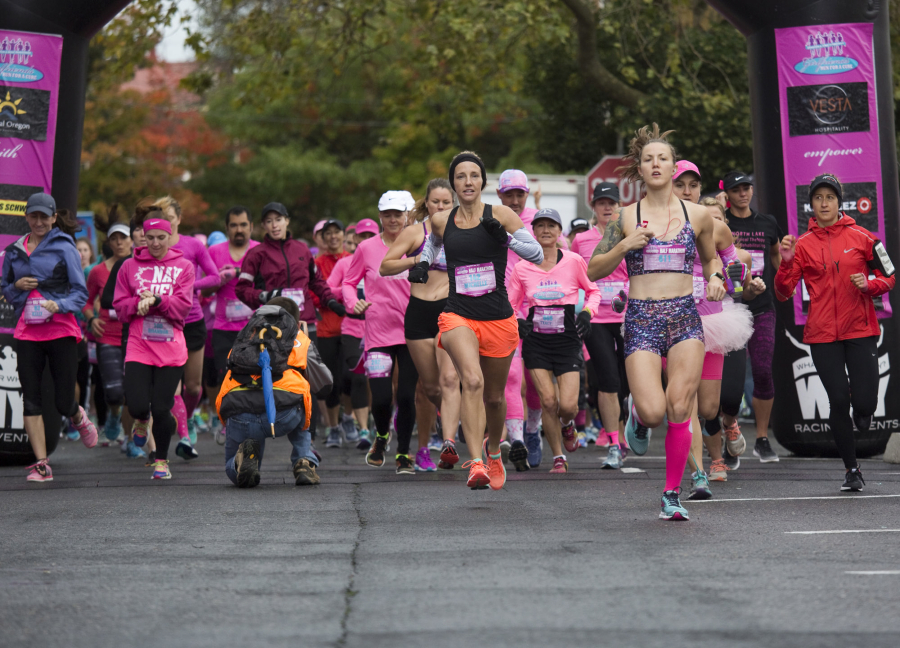 Runners set off at the starting line of the annual Girlfriends Run for a Cure in Vancouver on Sunday.