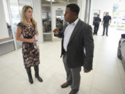 Milton Copeland, a sales manager at Dick Hannah Honda in Vancouver, helps out customer Carolyn Pickering in September.