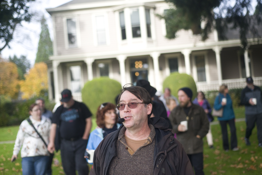 Historian Jeff Davis leads guests away from the O.O. Howard House on Sunday during a Spirit Tales walking tour around Officers Row and the West Barracks. The tour was presented by the Fort Vancouver National Trust.
