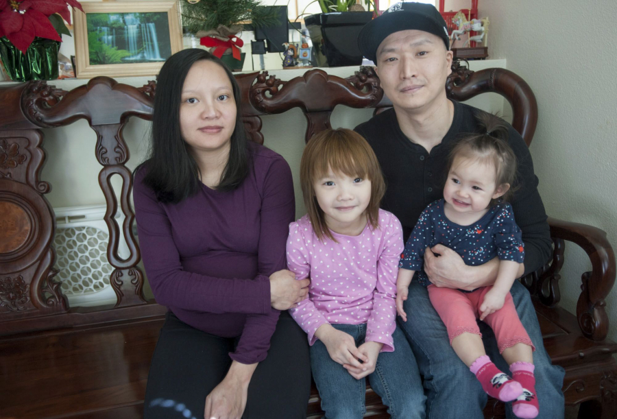 Adam Crapser with his wife Ahn, and daughters Tina and Crystal at their home in Vancouver in March 2015.