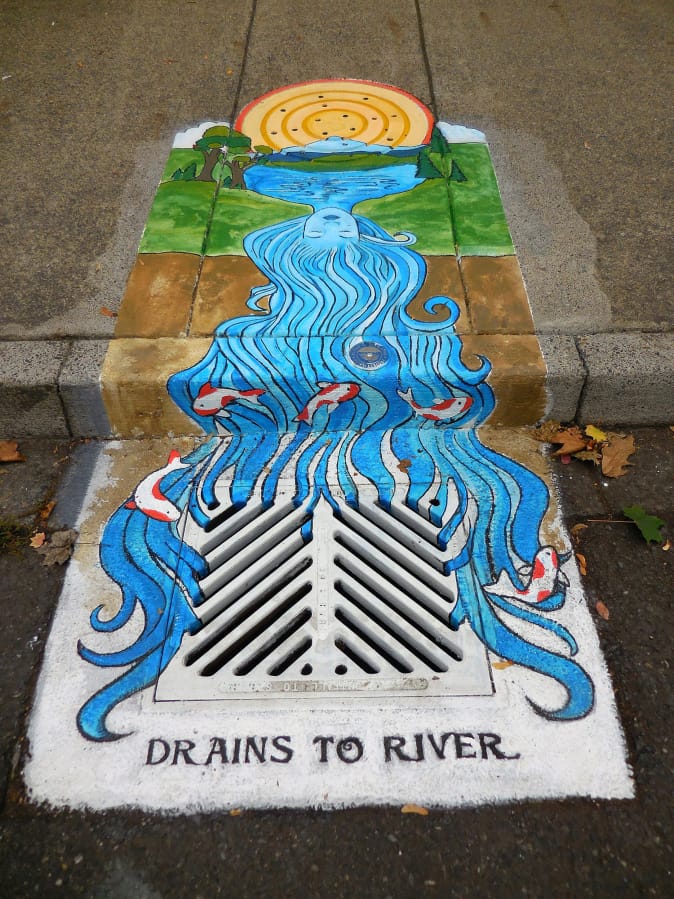 Arnada: Mother-daughter duo Racheal Stahlman and Sabra Morin teamed up to paint a goddess as part of the Vancouver Watersheds Alliance effort to raise awareness about what storm drains do by having local artists paint them.