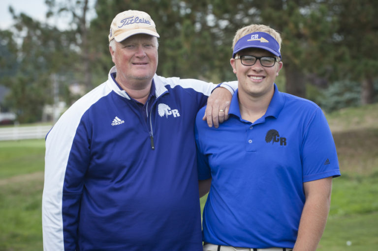 Spencer Long, right, stands with his dad, Columbia River coach, David Long, at Tri Mountain Golf Course in Ridgefield during practice, Thursday September 29, 2016.