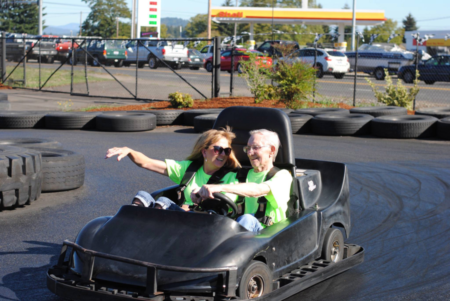 Salmon Creek: In honor of Active Aging Week, members of Highgate Senior Living, including executive director Melanie Danelson, left, and resident Lyle Brown, took a trip go-karting.