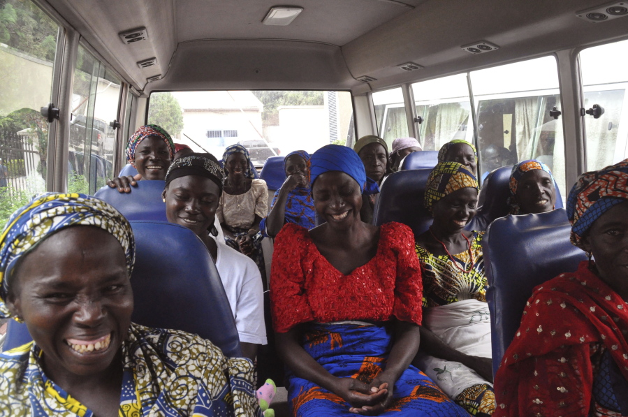 Family members of kidnapped Chibok girls leave on a bus for the Nigerian ministry of women&#039;s affairs Tuesday in Abuja, Nigeria.