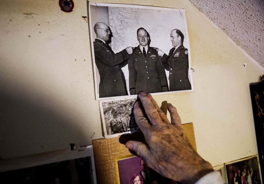 Memorabilia decorates a wall in the home of Frank Gleason, 96, a retired colonel with the Office of Strategic Services, in Atlanta, Wednesday, Sept. 28, 2016. Legislation to recognize the contributions of a group of World War II spies is hung up in Congress. Some 75 years ago, the OSS carried out missions behind enemy lines in Nazi Germany and the Pacific theatre. Gleason&#039;s group was tasked with halting the Japanese advance into China. Gleason and his comrades did this by detonating bridges, railroad tracks and anything else. &#039;We just blew stuff up left and right,&#039; said Gleason.
