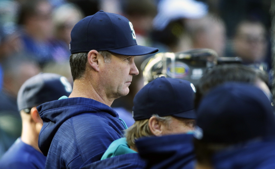 Seattle Mariners manager Scott Servais watches from the dugout during the eighth inning of a baseball game against the Oakland Athletics, Sunday, Oct. 2, 2016, in Seattle. (AP Photo/Ted S.