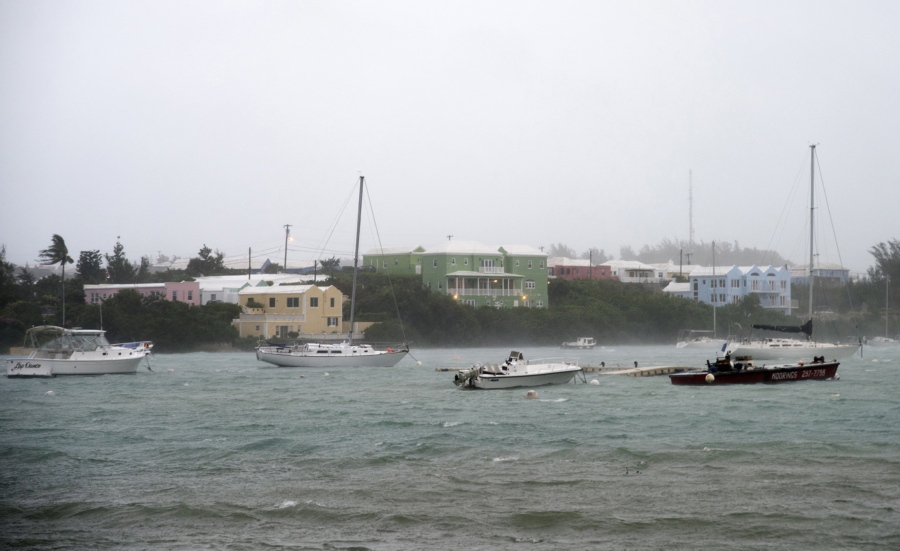 Heavy rain and increasing winds rock boats moored in Mullet Bay in St. Georges, Bermuda, Thursday, Oct. 13, 2016 as the island begins to feel the effects of Hurricane Nicole. The hurricane had strengthened to a Category 4 storm late Wednesday but lost some steam overnight. However, forecasters warned that it was still extremely dangerous.