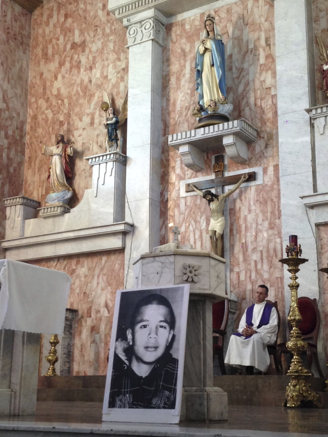 A photo of Jose Antonio Elena Rodriguez, who was fatally shot by U.S. Border Patrol near the Mexico-U.S border, leans against a podium on a church altar during a memorial mass in Nogales, Sonora, Mexico. The civil rights case against Agent Lonnie Swartz over the Rodriguez&#039; death will go forward after U.S. District Court Judge Raner C. Collins denied a part of his motion to dismiss the case.