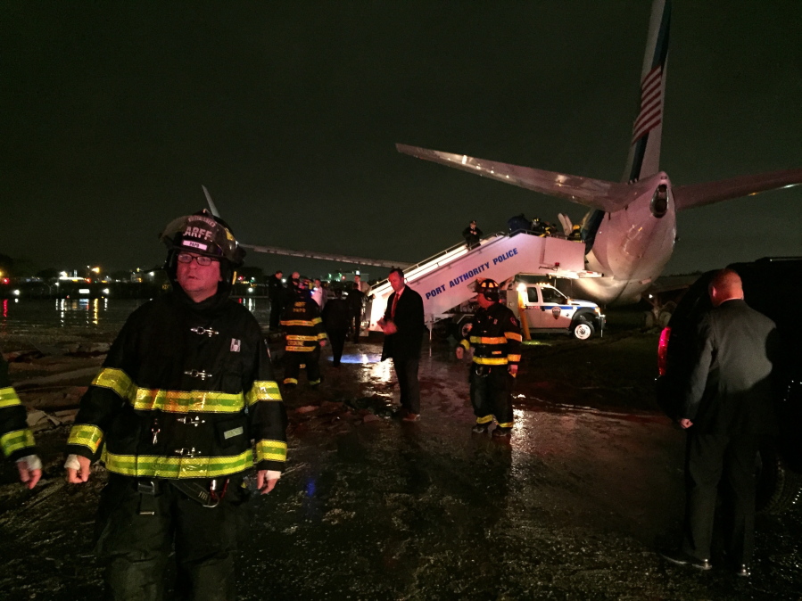 The campaign plane of Republican vice presidential candidate Indiana Gov. Mike Pence sits off a runway at New York&#039;s LaGuardia Airport on Thursday after it slid off a runway during a rainstorm during landing. Pence told reporters that no one had been injured.