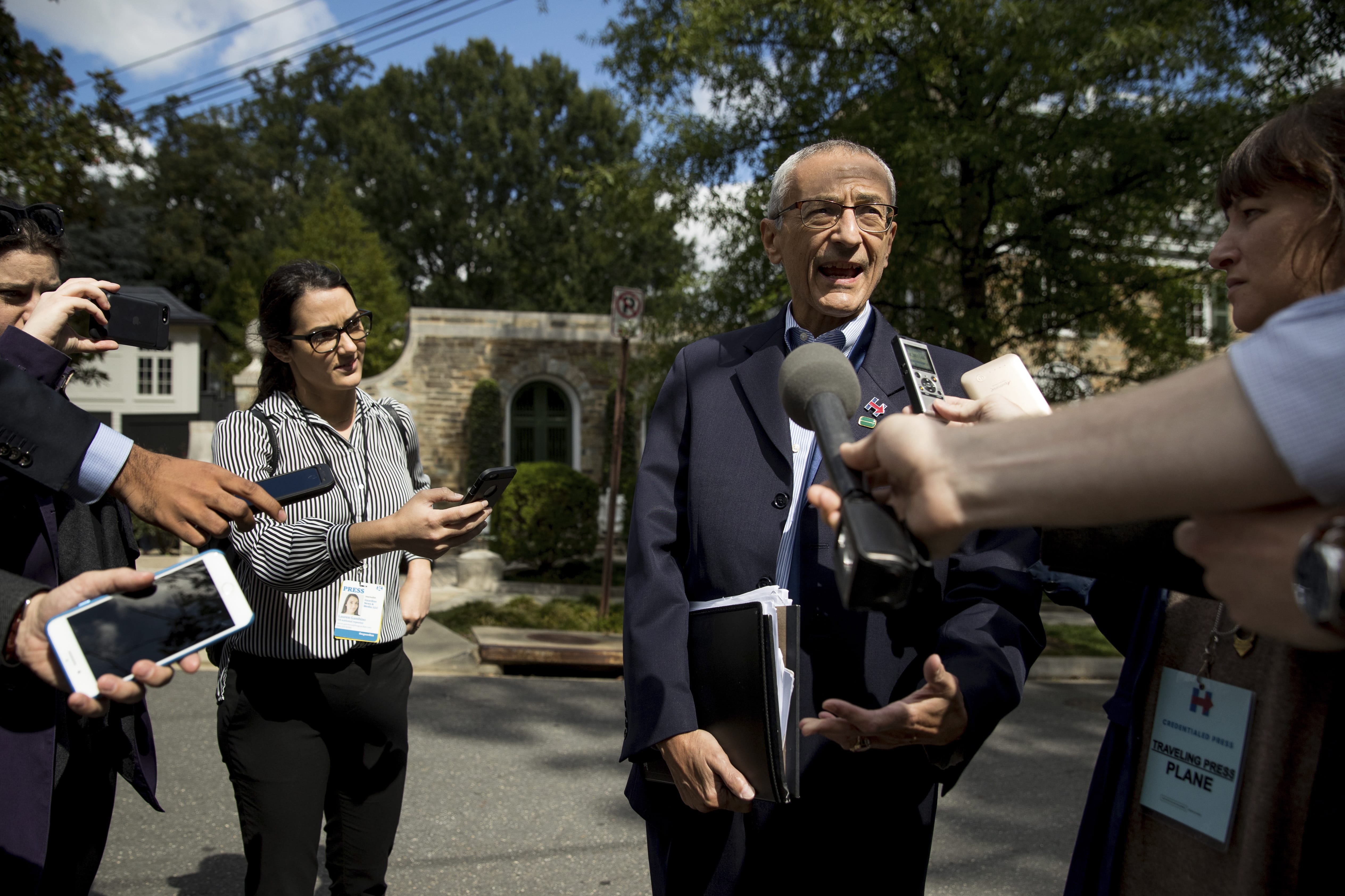 In this photo taken Oct. 5, 2016, Hillary Clinton's campaign manager John Podesta speaks to members of the media outside Democratic presidential candidate Hillary Clinton's home in Washington. Hacked emails show Hillary ClintonÄôs campaign wrestled with how to announce her opposition to construction of the controversial Keystone XL pipeline without losing the support of labor unions that supported to project. Emails published this week by WikiLeaks show debate and confusion within the Clinton camp as it faced down the unexpectedly strong primary challenge by liberal Sen. Bernie Sanders, who opposed the pipeline.