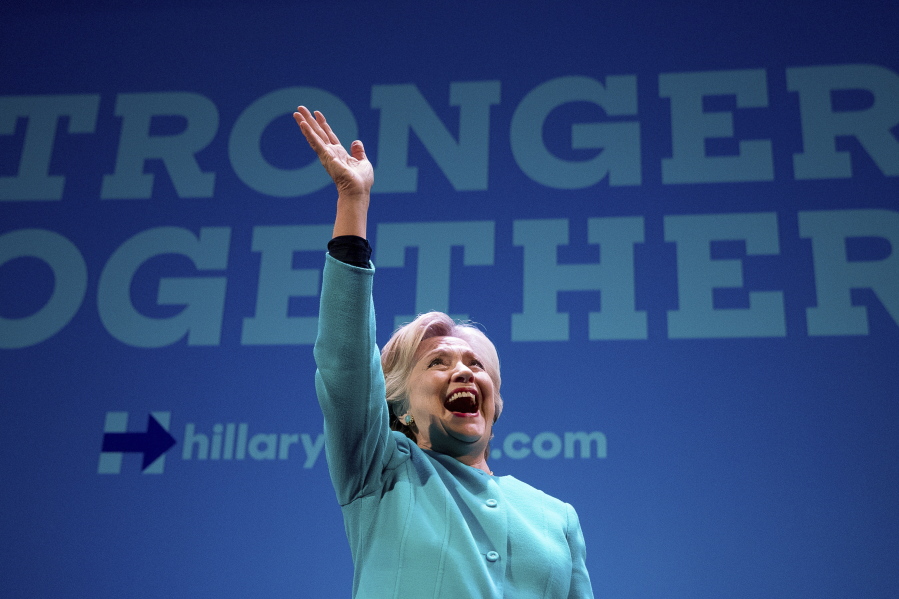Democratic presidential candidate Hillary Clinton waves as she takes the stage to speak at a fundraiser Friday at the Paramount Theatre in Seattle.