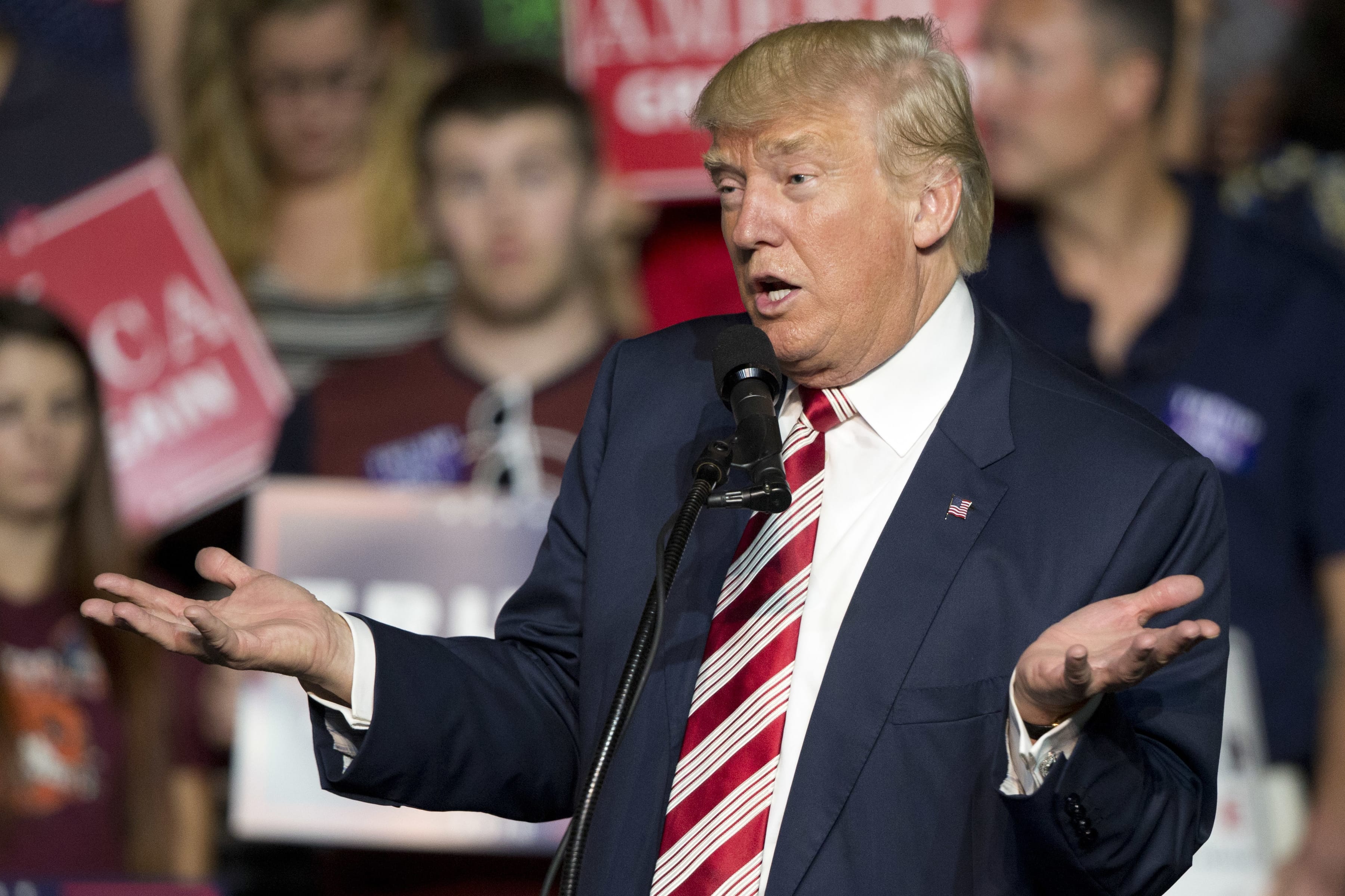 FILE – In this Sept. 24, 2016, file photo, Republican presidential candidate Donald Trump gestures during a rally in Roanoke, Va. Countless former Democrats in Ohio's blue-collar Mahoning Valley are transferring their adoration for late U.S. Rep. James A. Traficant Jr., D-Ohio, to Trump, while those who knew Traficant say similarities between him and Trump end at the populist bravado and outsized hair.