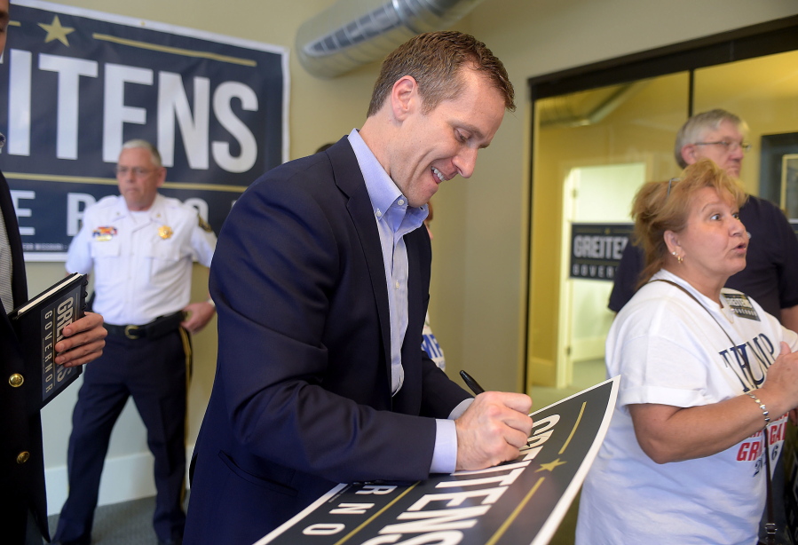 Missouri Republican gubernatorial candidate Eric Greitens meets with supporters Aug. 26 in downtown St. Joseph, Mo. Gubernatorial candidates in some states including Missouri have been staking strategic positions contrary to their party&#039;s national norms and presidential nominees. A former Navy SEAL officer, Greitens faces Democratic nominee, Attorney General Chris Koster in the general election. (Jessica Stewart/St.