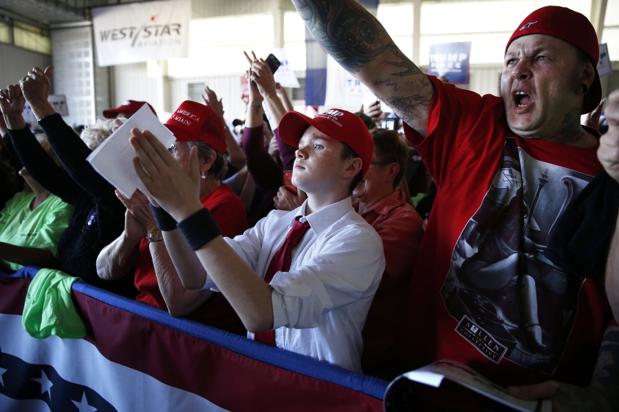 Supporters of Republican presidential candidate Donald Trump cheer as they listen to Trump speak at a campaign rally Tuesday in Grand Junction, Colo.