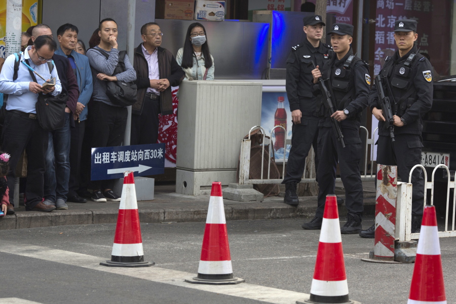 Heavily armed Chinese police officers block a road as Philippine President Rodrigo Duterte visits a shopping mall in Beijing, China, on Wednesday. This week&#039;s visit to China by Duterte points toward a restoration of trust between the sides following recent tensions over their South China Sea territorial dispute, China&#039;s official news agency said Tuesday.