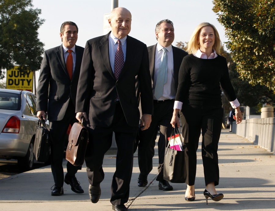 Gov. Chris Christie&#039;s former deputy chief of staff Bridget Anne Kelly, right, arrives at Martin Luther King Jr. Courthouse with her attorneys Michael Critchley Jr., second right, and Michael Critchley Sr., third right, Monday in Newark, N.J.