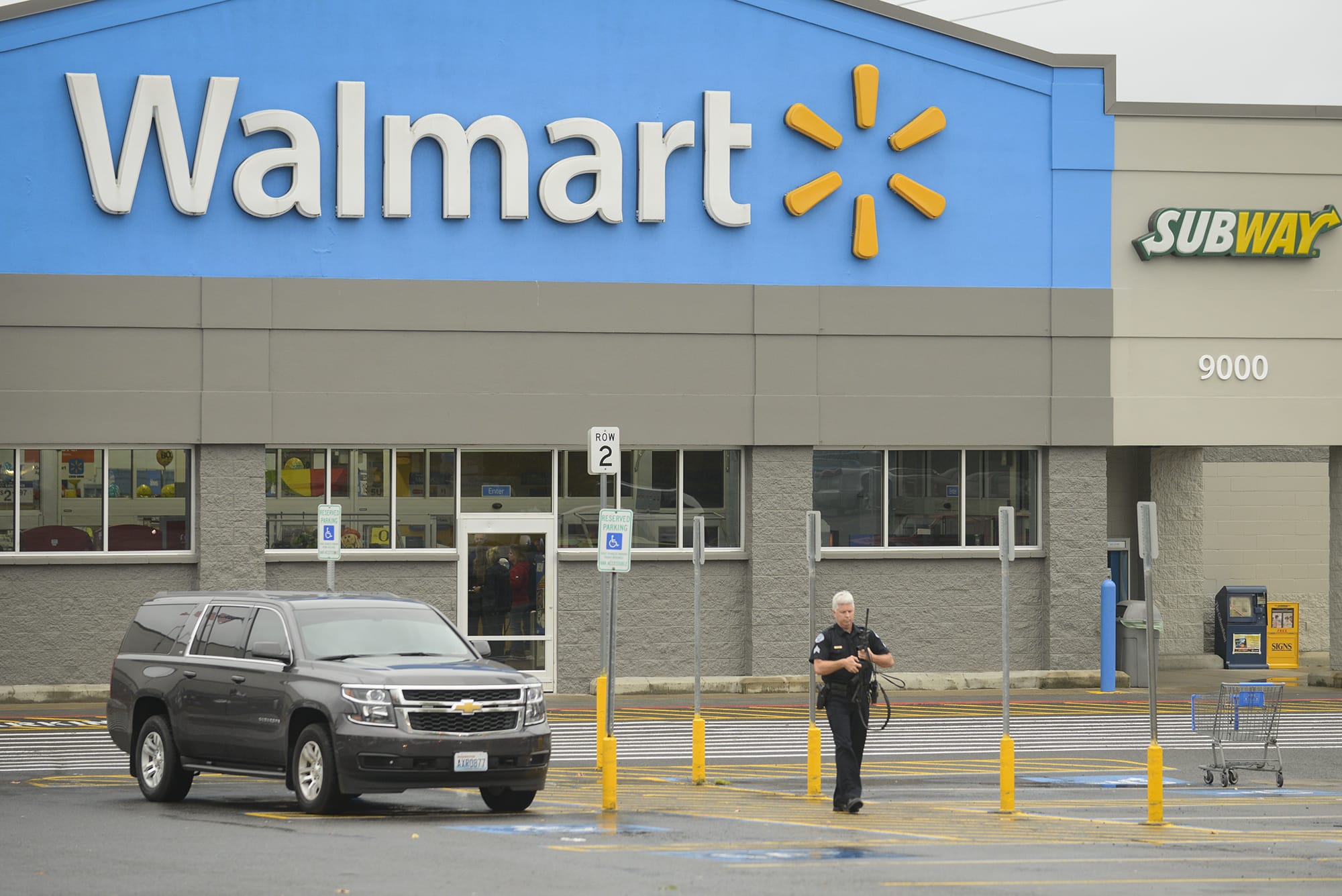 Law enforcement officials investigate after a shooting at the Hazel Dell Wal-Mart on Wednesday morning.