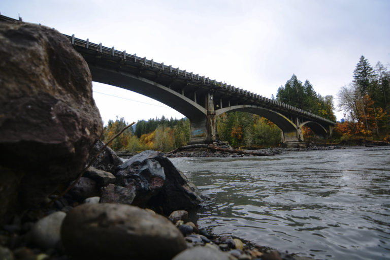 This Wednesday, Oct. 19, 2016 photo shows the U.S. Highway 101 bridge spanning the Elwha River west of Port Angeles, Wash. The Washington State Department of Transportation is exploring options for the bridge, as the now-wild river continues to eat away at the riverbed under the structure. A recent examination of the bridge, which was built in 1926, found that the piers are resting on gravel and not bedrock.