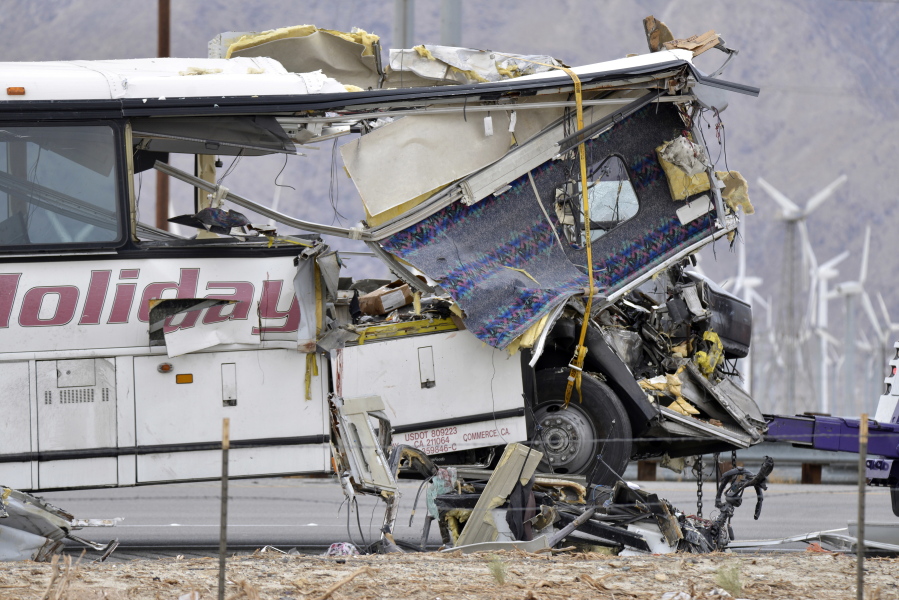 The damaged front of a tour bus is seen that crashed into the back of a semi-truck on Interstate 10 just north of the desert resort town of Palm Springs, in Desert Hot Springs, Calif., on Sunday. Several deaths and injuries were reported.
