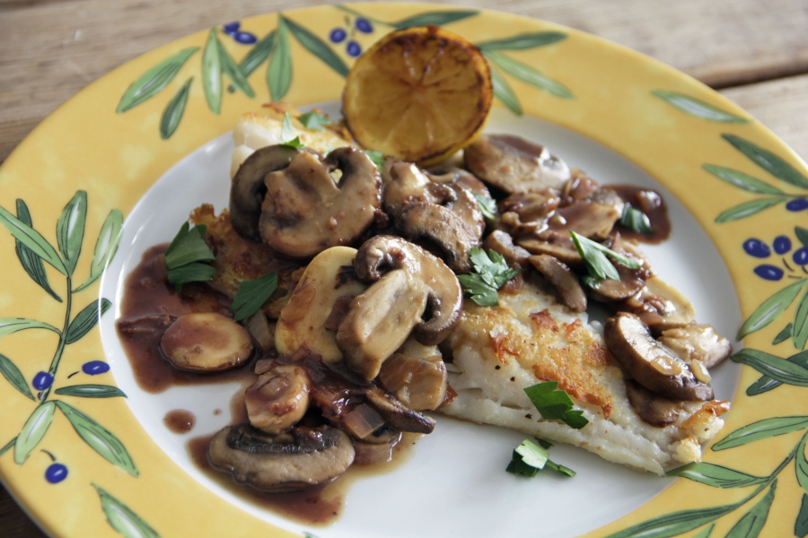 Cod with red wine pan sauce and mushrooms (Associated Press)